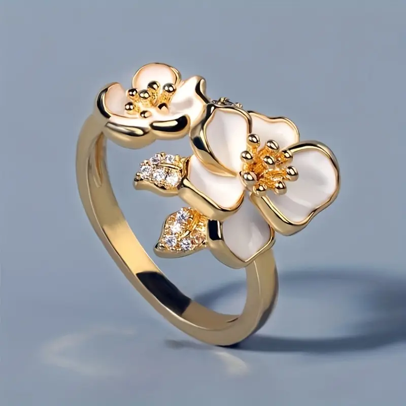 Floréalys – Bague dorée avec fleurs blanches